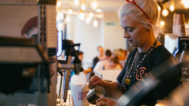 Student working in coffee revolution