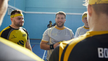 Male students wearing sports clothing in Goodwin sports hall