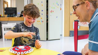 Photo of boy and nurse