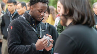 ISAN Conference delegate interacting with  exhibitors