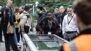 ISAM 24 group of delegates looking at exhibitor equipment