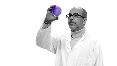 Professor Mimoun Azzouz holding a petri dish