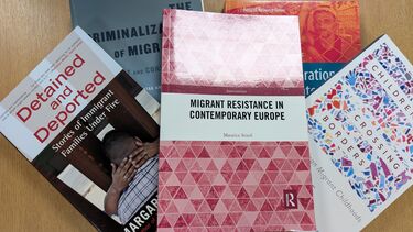 5 migration books on the table