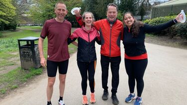 2 males and 2 females are celebrating having just finished a run