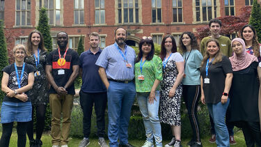 Team members of Rinri Therapeutics standing together as a group outside Firth Court
