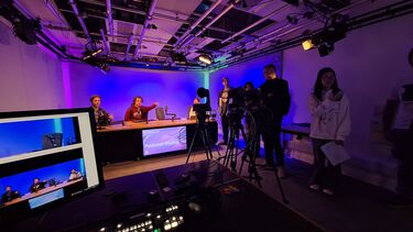 Group of students in the studio recording a podcast