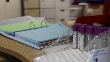 Blood tubes next to some files