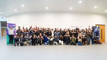 group of students in shot smiling at camera