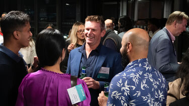 Dean of the Management School Professor Fraser McLeay networks with alumni