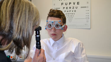 Paediatric orthoptics patient having vision tested
