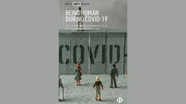 A cover of a book with a grey cover, featuring small plastic figures of people. 