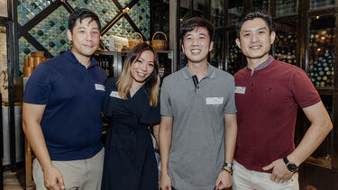 Sheffield alumni smiling to the camera at the Singapore alumni event.