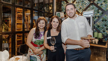 Sheffield alumni smiling to the camera at the Singapore alumni event.