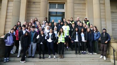 46 dental students stand together in a group smiling before setting off on the Mouth Cancer Foundationir 10km fundraising walk for the