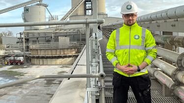 AMRC Training Centre apprentice Alex Whinfrey-Gibson on site wearing a high vis jacket