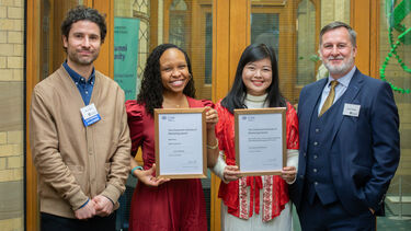 CIM representative Jonny Crawley and Professor Damian Hodgson smile with CIM winners Lauren Bartlett and Fransiska Sonia Rickiyanto