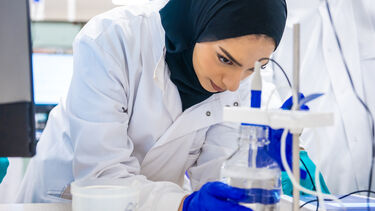 Photo of student working in the lab
