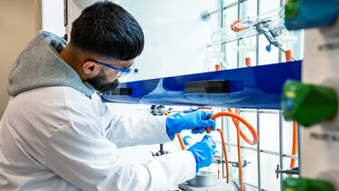 Chemistry student working in fume cupboard