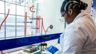 Chemistry student working in fume cupboard