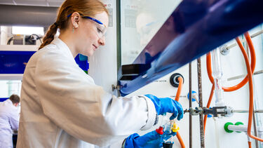 Chemistry student working in fume cupboard