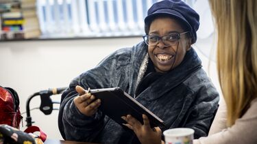 Woman with a beret at desk