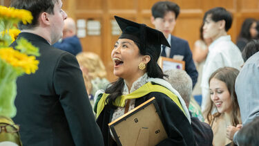 Graduate celebrates at prize giving ceremony