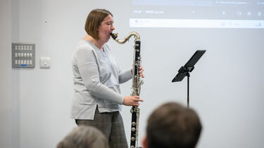 musician playing clarinet on stage