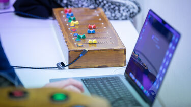 instrument on table next to laptop