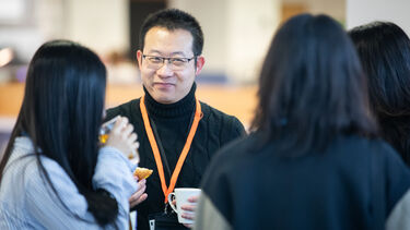 Management School PGR students socialising at the doctoral conference