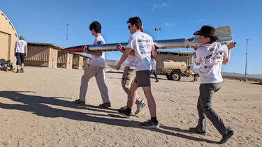 Sheffield engineering students carrying a rocket they have built in a Californian desert ahead of launching it as part of global rocket-building competition.