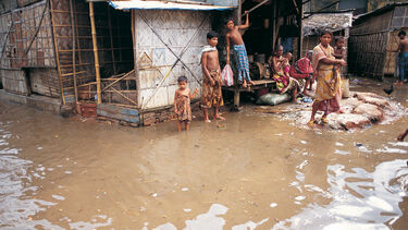 GettyImages-dv118009_Floodwaters surrounding houses in Dhaka,Bangladesh
