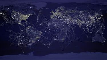A map of the world with lit up lines showing networks.
