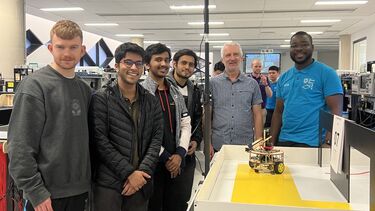 Abhishek with his group members in the lab