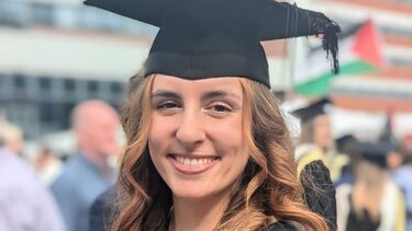 Laura in graduation cap and gown