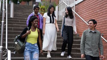 Students walking down staircase