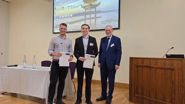 Matthew Bellamy and Orrin Day won the prizes for the best oral presentations; they are receiving their awards from Professor Richard Eastell, Director of the Mellanby Centre. 