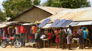 A community market with improvised solar panels.