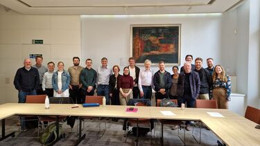 a photograph of all workshop participants smiling in a line