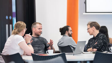 A group of people having a discussion at workshop