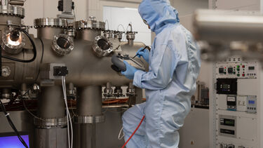 An academic using equipment in the National Epitaxy Facility
