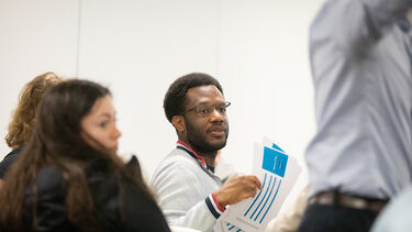 Man in group work at emerge session