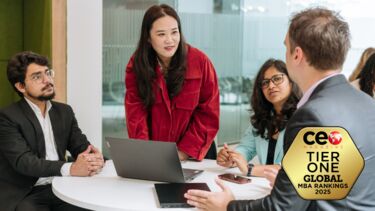 Students working together. Overlaid is a badge saying CEO Magazine Tier One Global MBA Rankings 2025.
