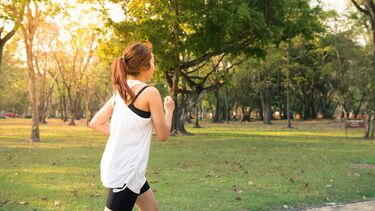 A woman running through a park