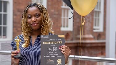 Picture of student showcase winner holding certificate 
