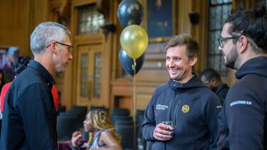 Group of entrepreneurs smiling and networking