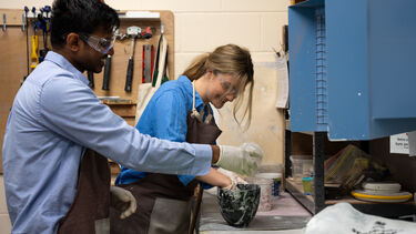 Students making architectural models in the casting room