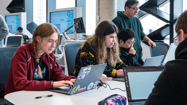 A group of students coding