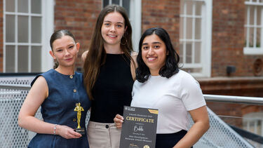 3 entrepreneurs standing holding certificates