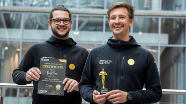 Two winners posing for Showcase