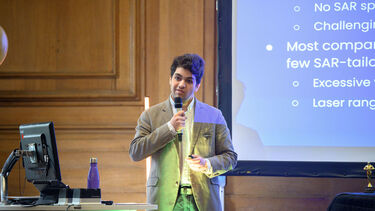 Founder speaking with microphone